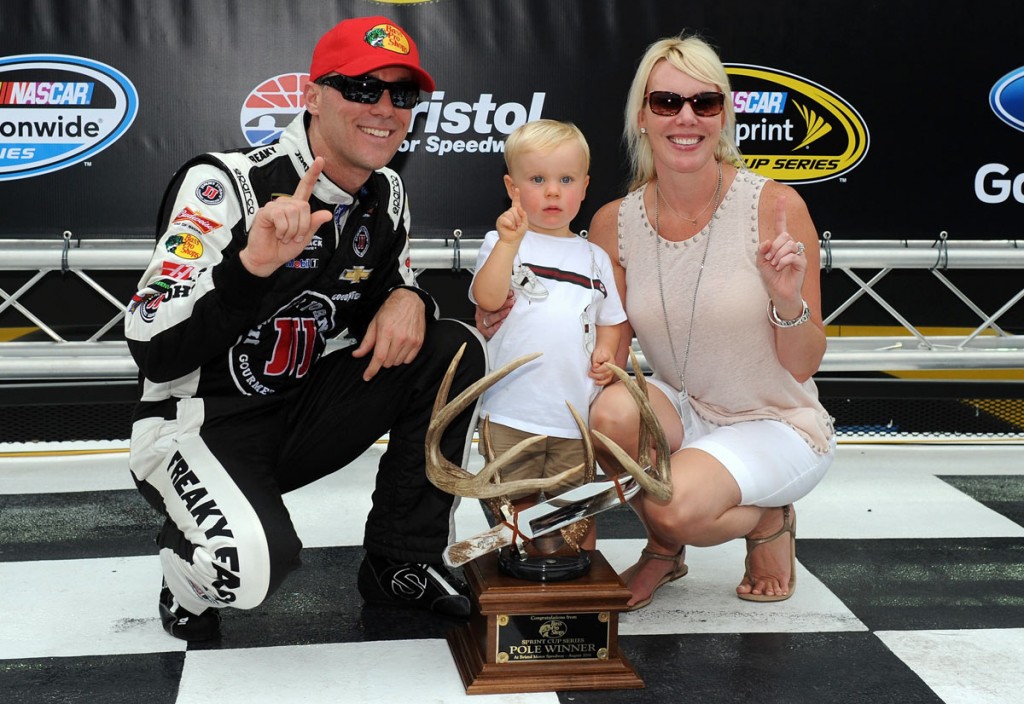 Kevin Harvick celebrates the pole win with son Keelan and wife Delana (photo - Rainier Ehrhardt/Getty Images for NASCAR)