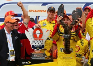 Joey Logano gets the traditional winners lobster in Victory Lane (photo - Jonathan Ferrey/Getty Images for NASCAR)