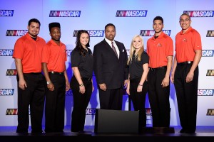 (L-R) Collin Gabre, Dylan Smith, Kenzie Ruston, Max Siegel, CEO of Rev Raving, Natalie Decker, Devon Amos, and Jay Beasley. These drivers will represent the Drive for Diversity program in 2015. 