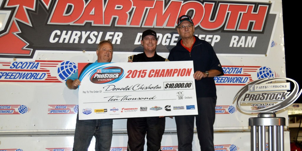 Donald Chisholm (middle) accepts the championship cheque (photo - Ken MacIsaac)